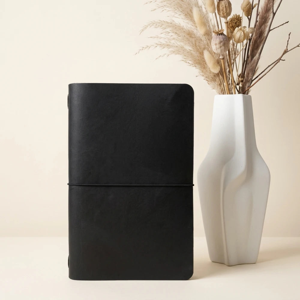 Minimalist writing sleeve crafted from natural leather for convenient daily journaling.