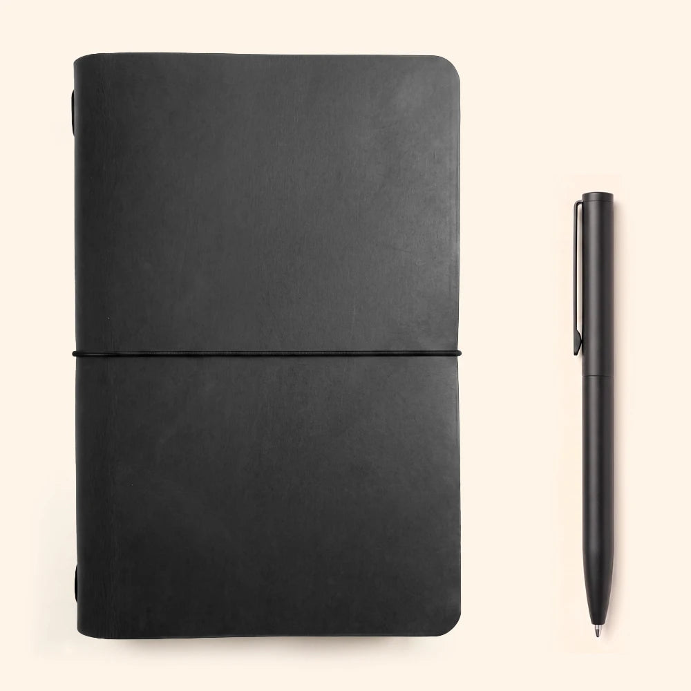 Handcrafted leather journal holder with refined edges and functional notebook support.