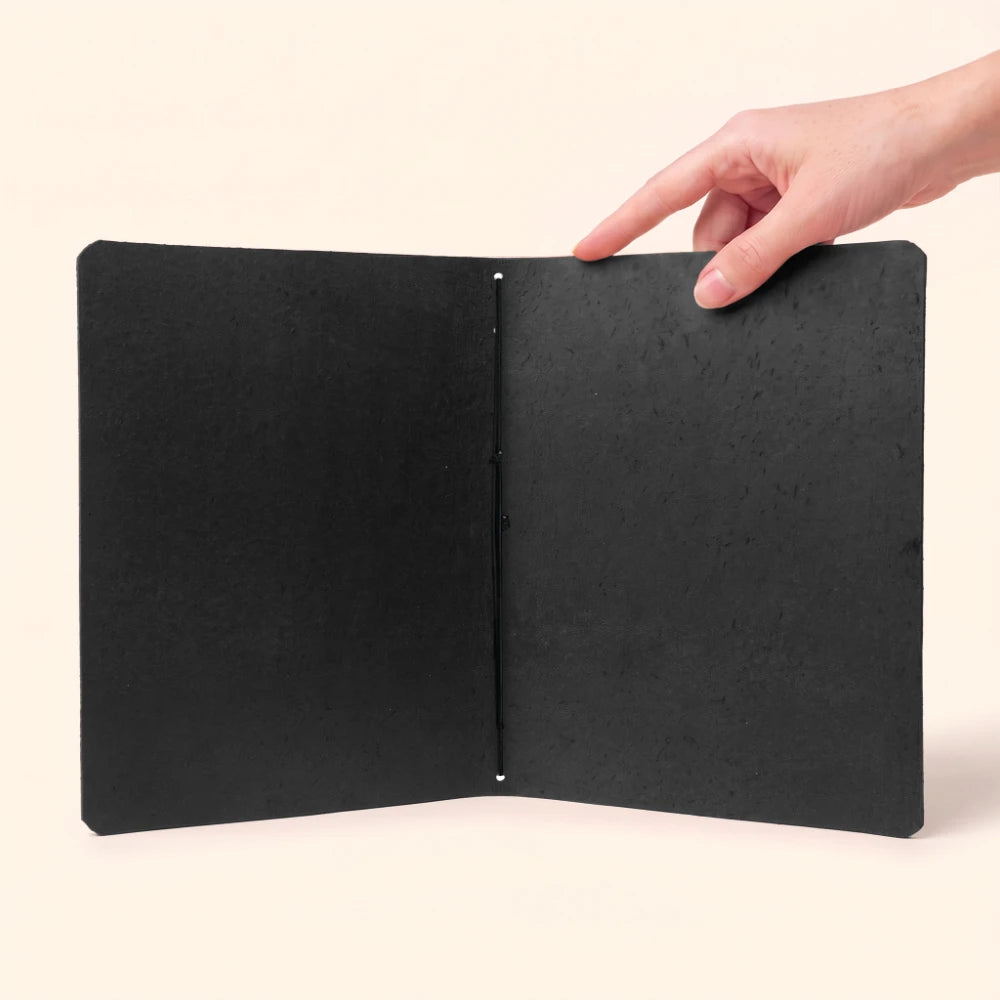 Handcrafted journal sleeve featuring supple leather and uncomplicated elastic notebook retention.