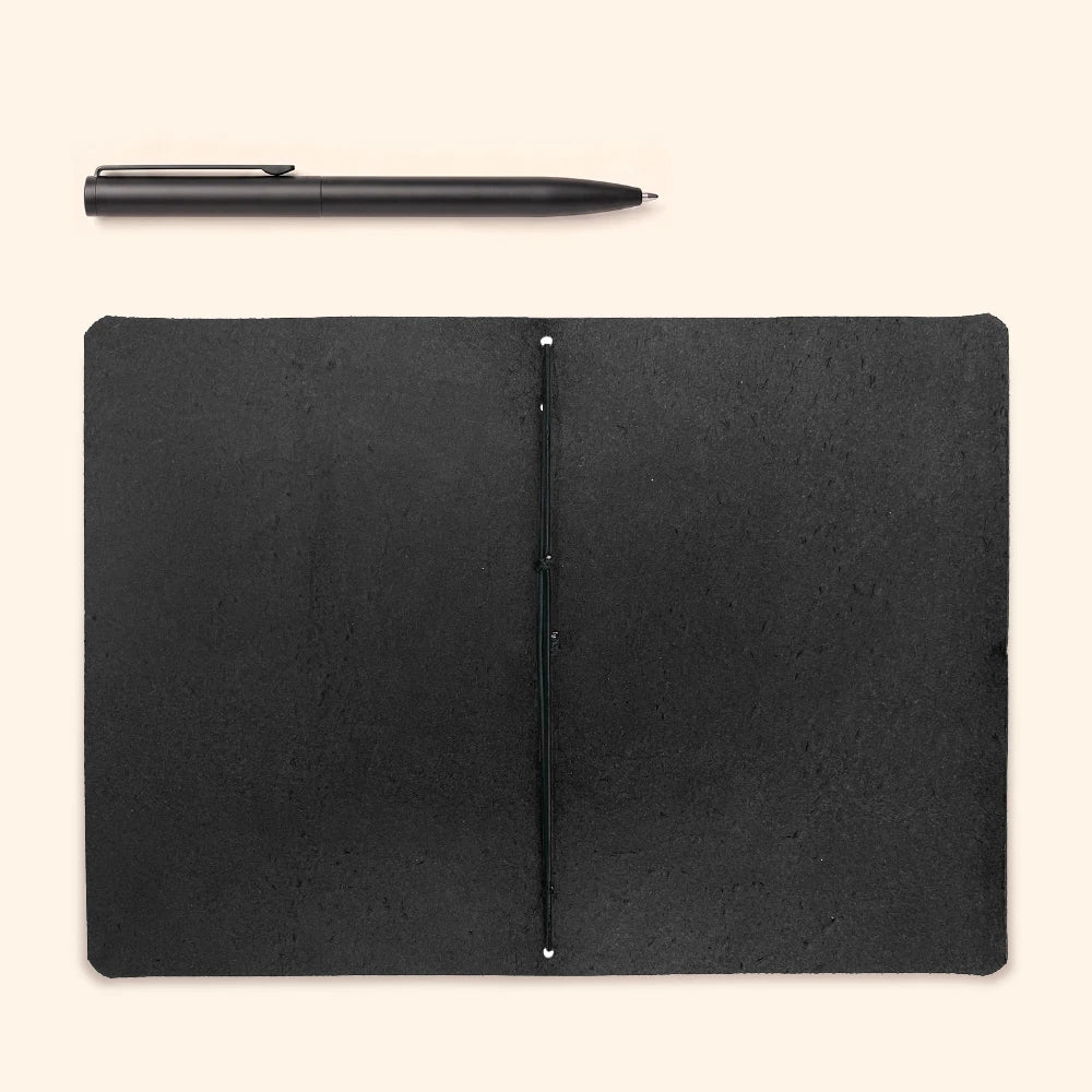 Handmade leather journal case featuring practical construction for convenient daily note-taking.