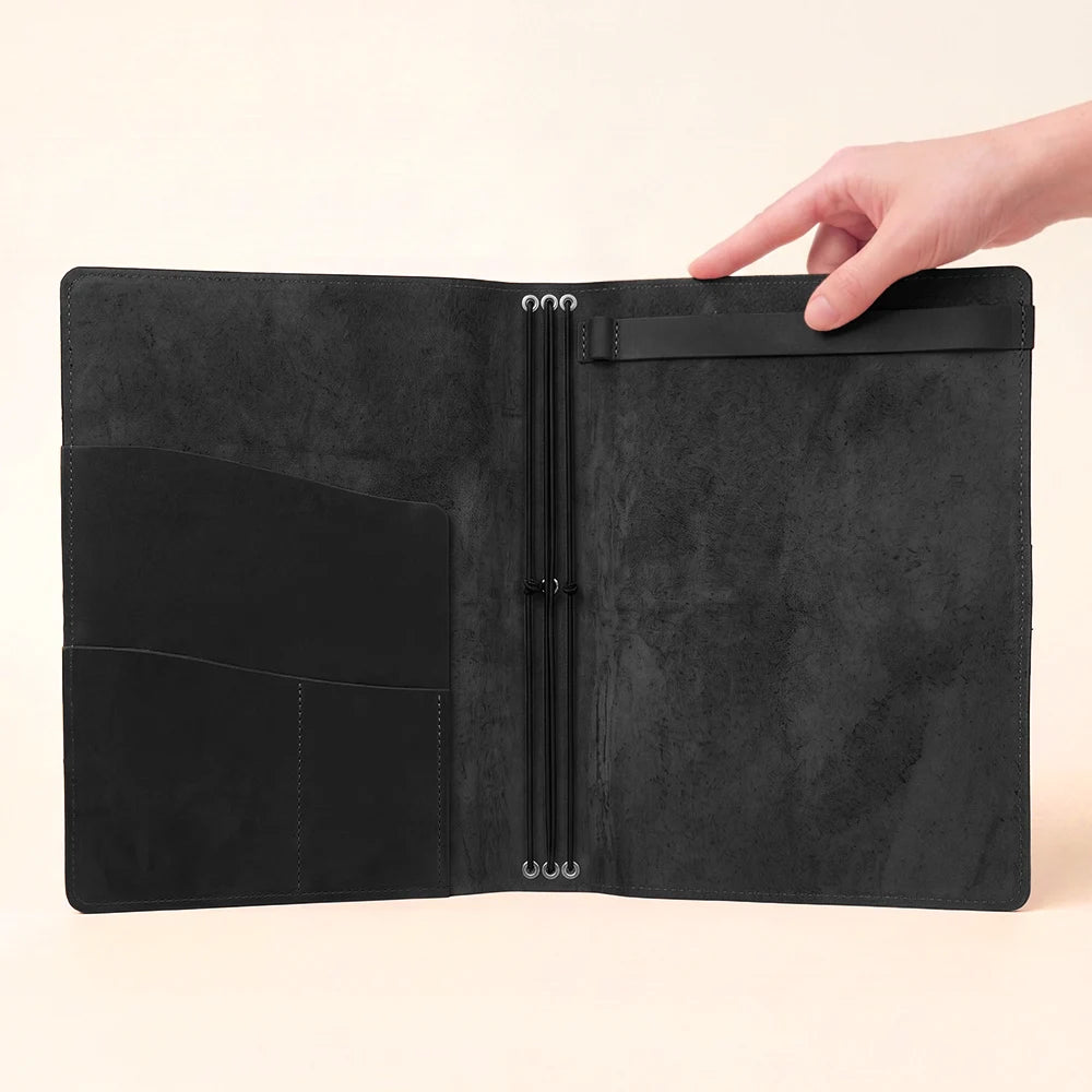 Natural leather writing organizer with a secure sketchbook section and layered pockets.