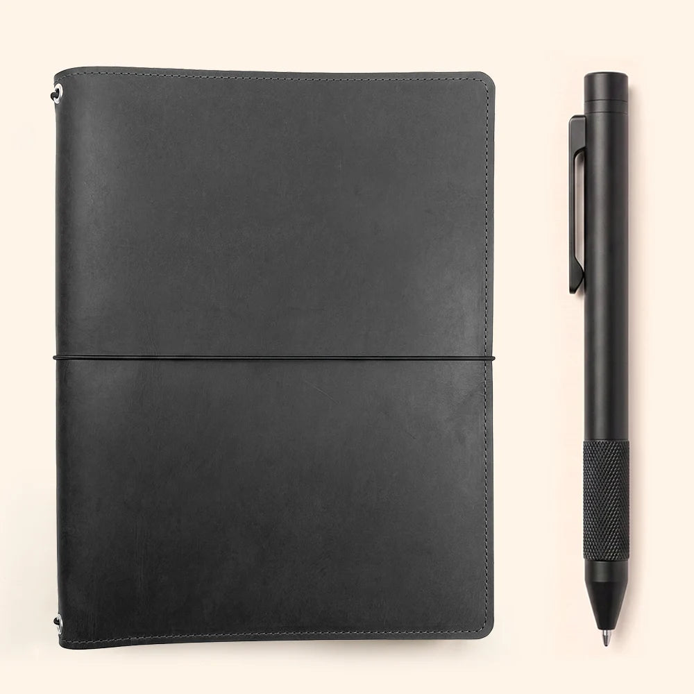 Natural leather refillable journal cover with three bands and functional interior pockets.