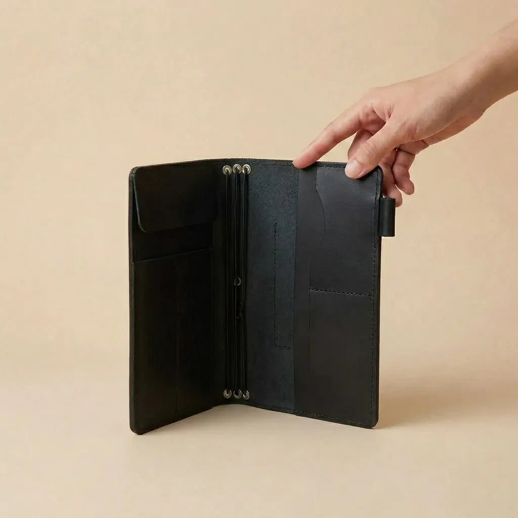 Genuine leather planner cover with elastic closure and organized accessory storage interior