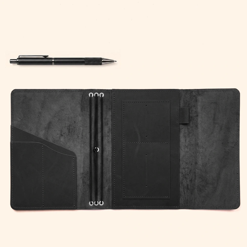 Premium refillable notebook cover with leather organizer pockets and dedicated writing accessory holder.