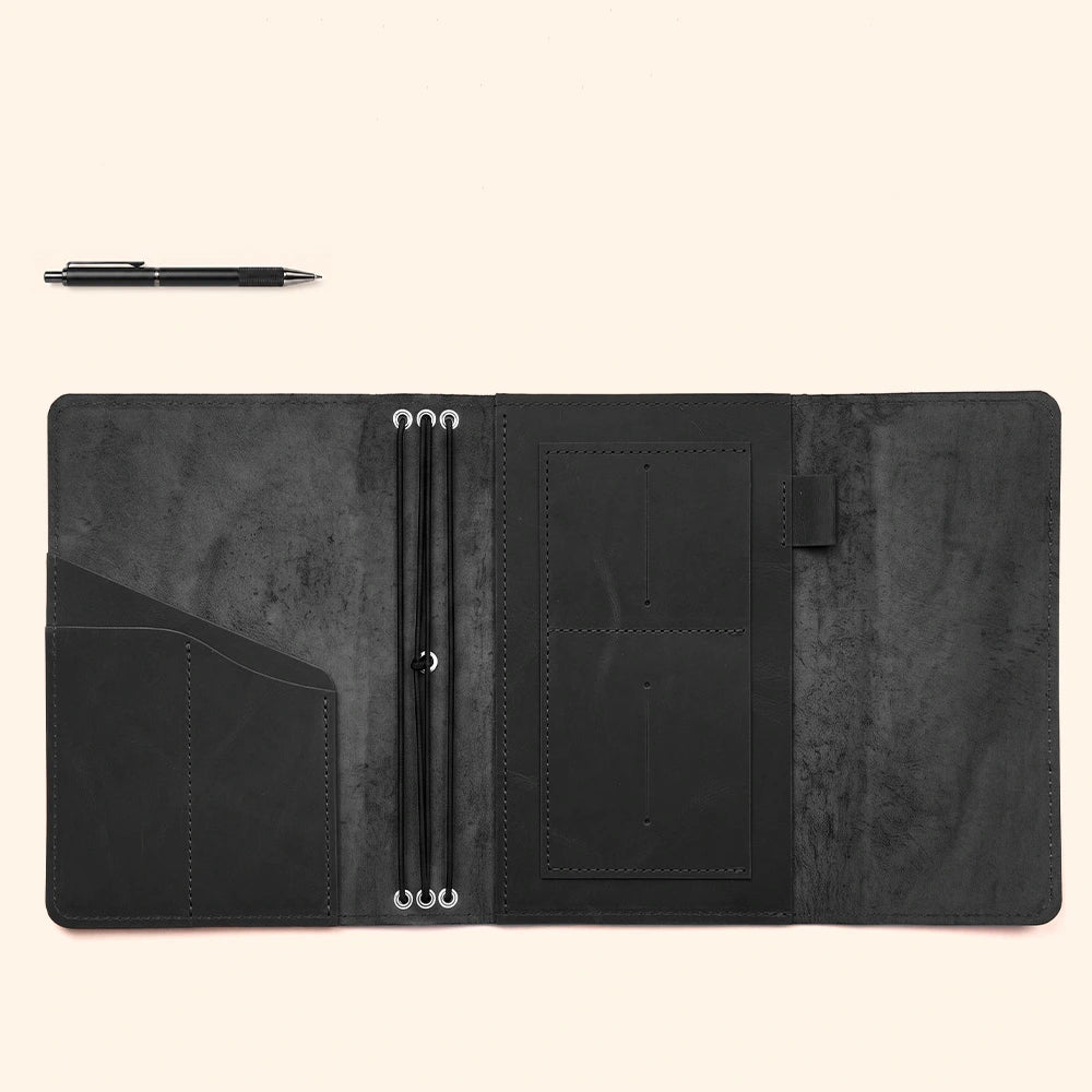 Premium refillable journal portfolio with interior organizers and integrated leather pen sleeve.