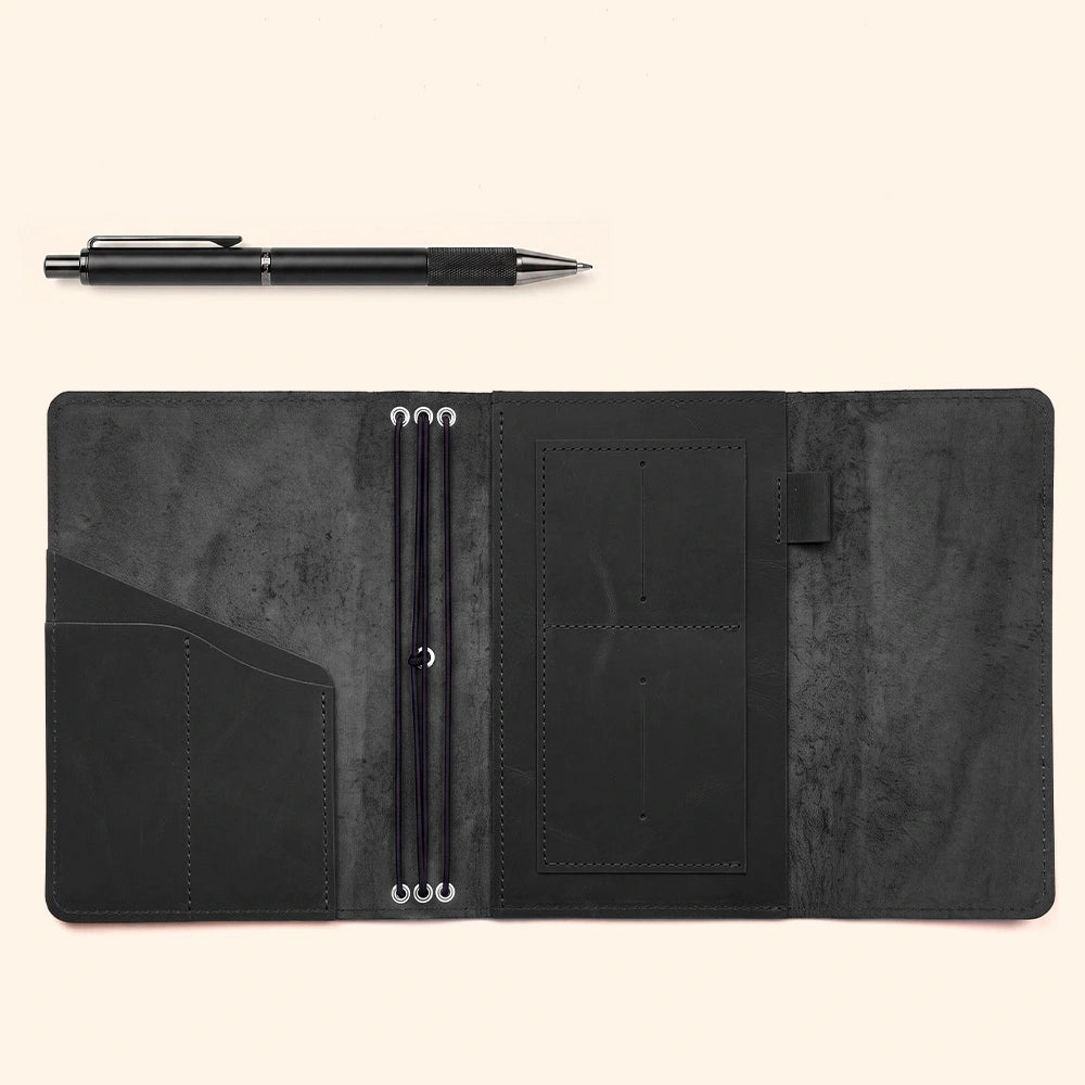 Premium handmade notebook cover with interior pockets and practical pen loop for writing.