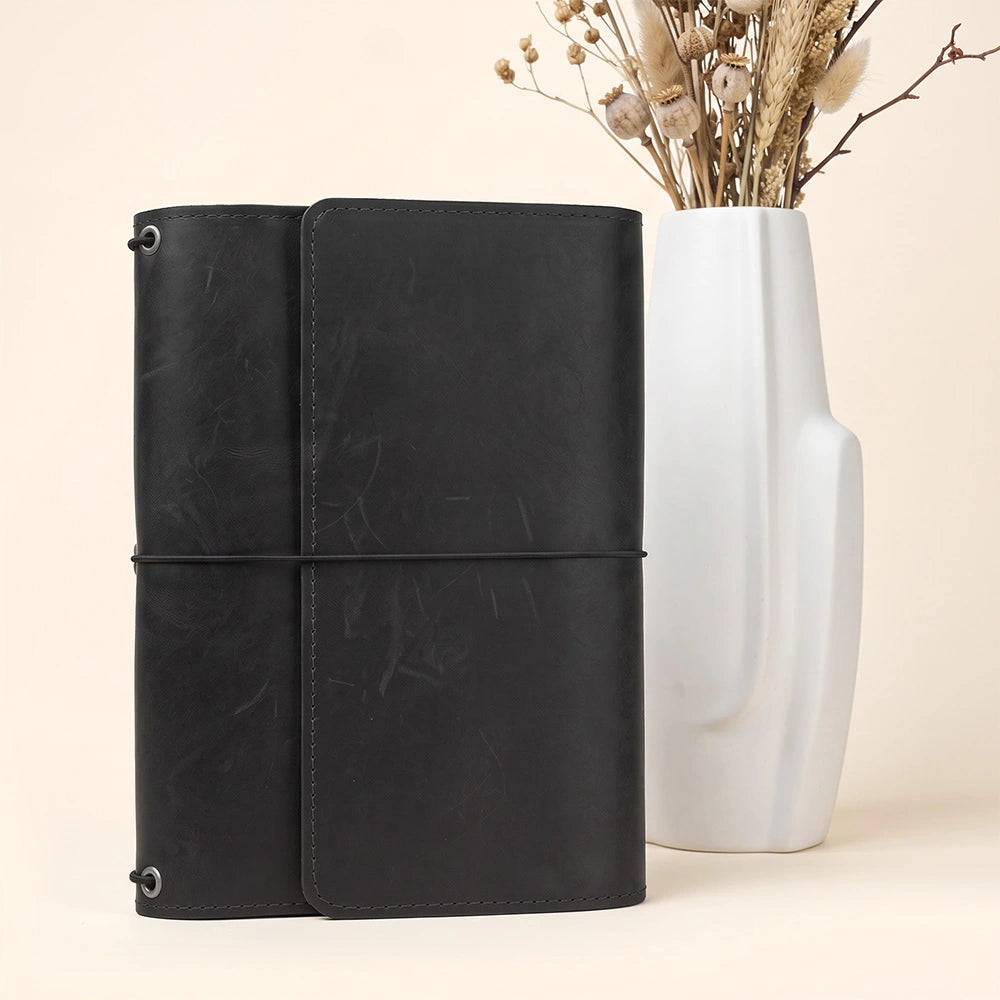 Genuine leather journal organizer featuring multiple inside pockets and secure pen holder.