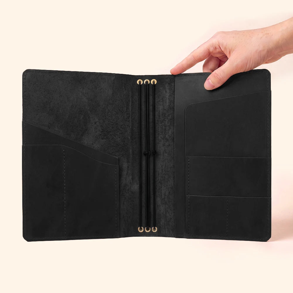 Handmade natural leather notebook holder with three secure elastic loops inside.