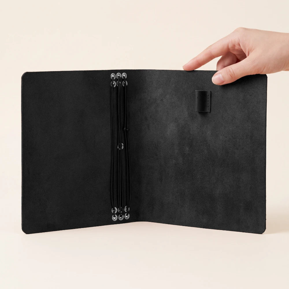 Durable refillable notebook cover crafted from genuine leather for six inserts.