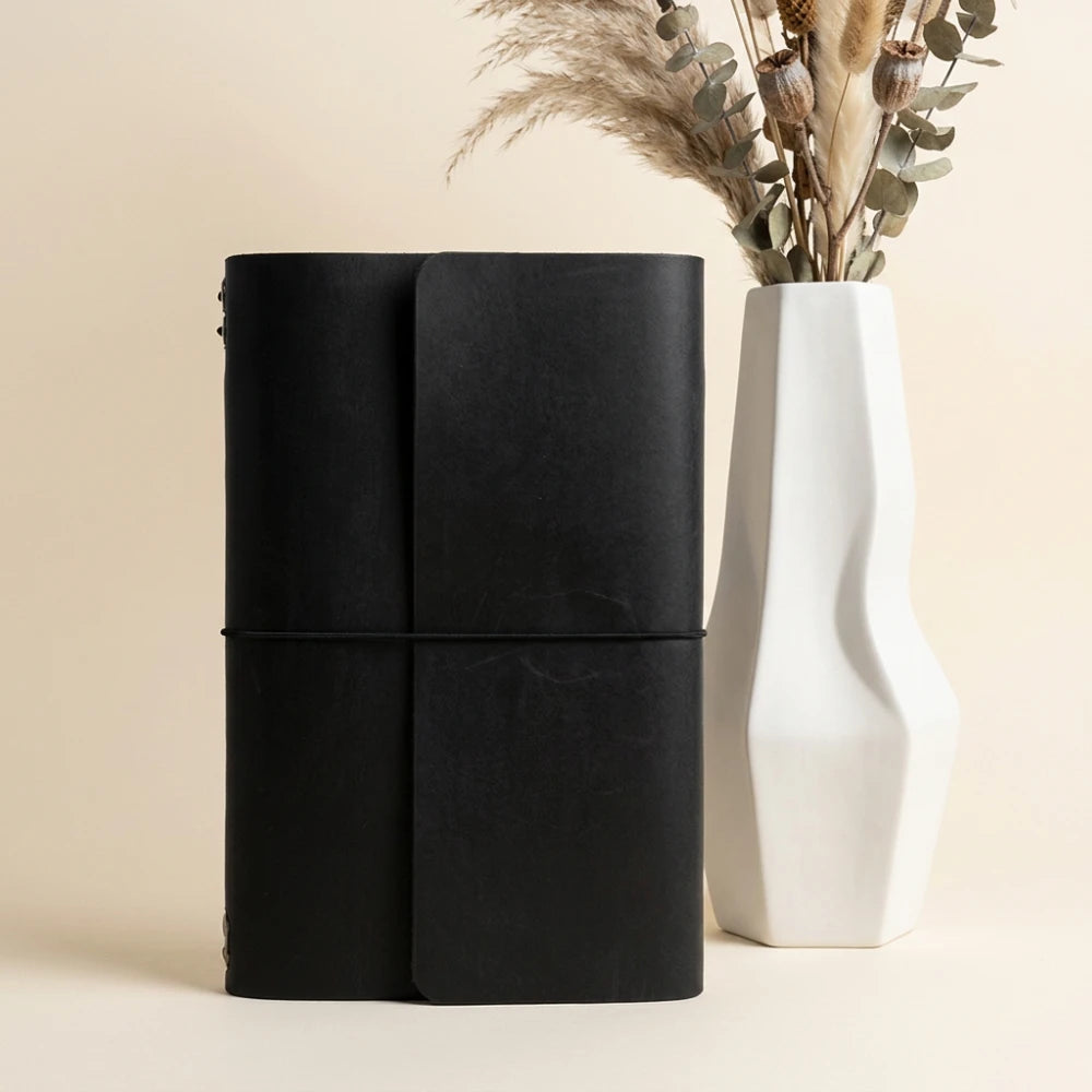 Premium natural leather notebook cover featuring six secure elastic attachment bands.
