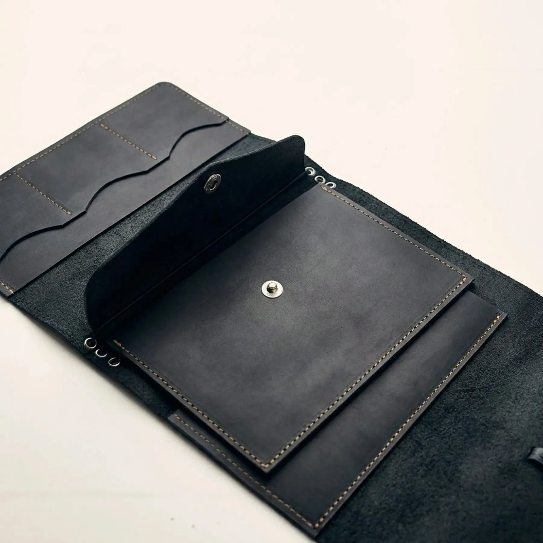 Handmade leather notebook insert shaped like an envelope
