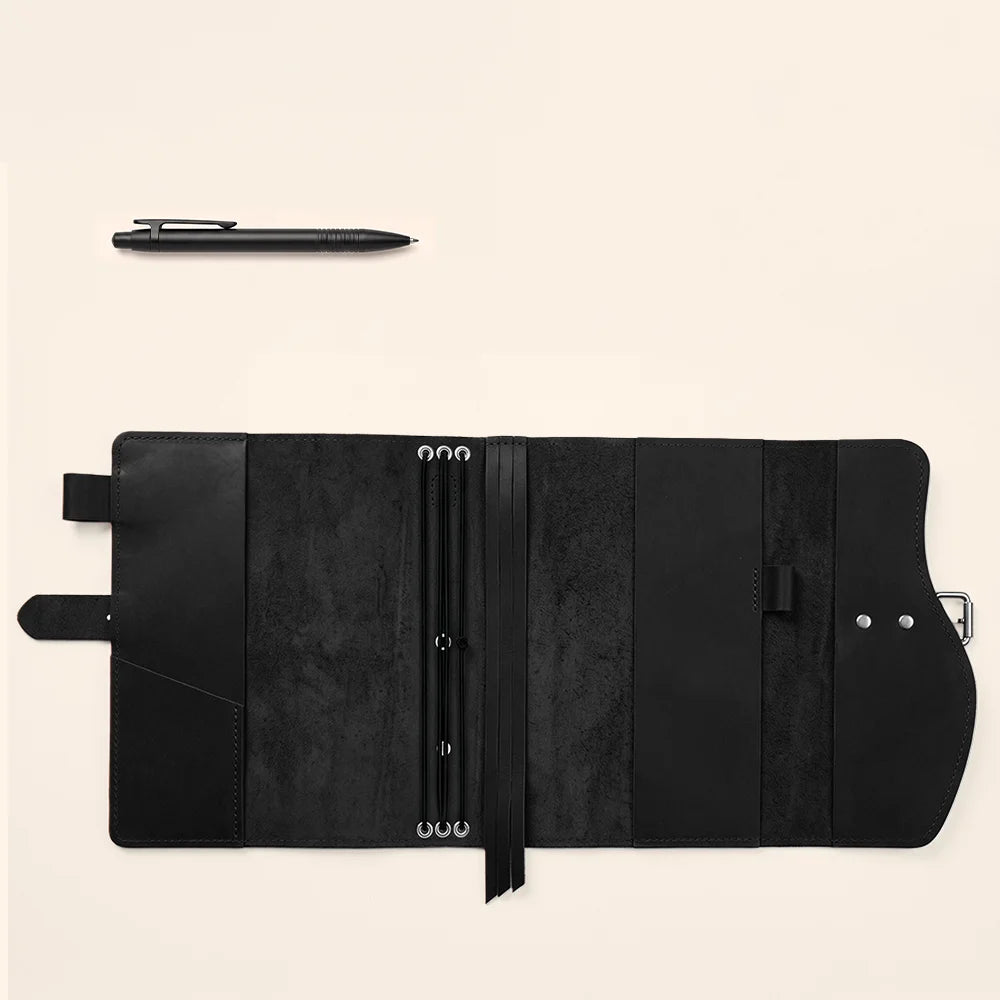 Handmade natural leather notebook cover with inner compartments, pen loop, page marker, and portable handle.