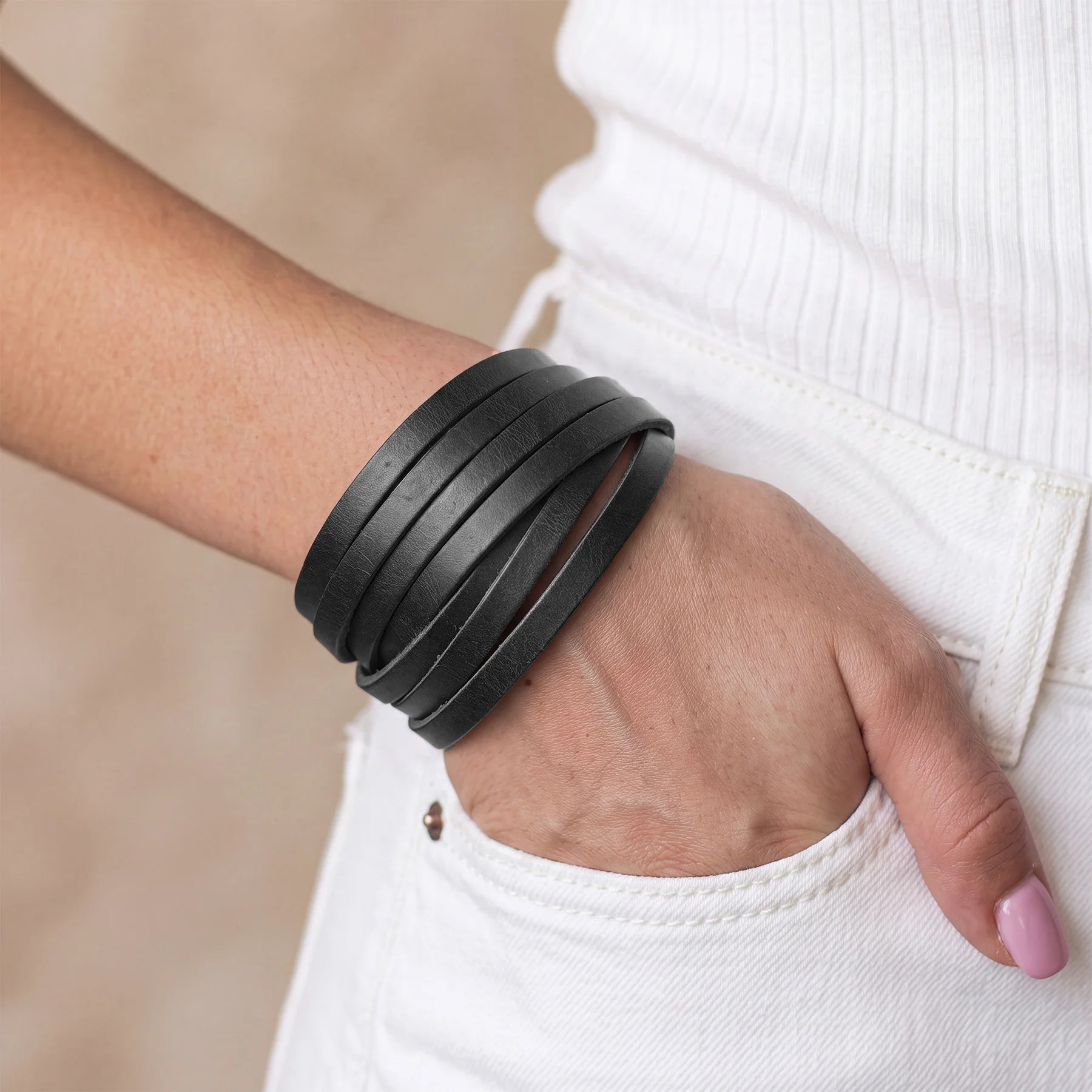 Handmade genuine leather bracelet with secure snap button closure and minimalist everyday design.