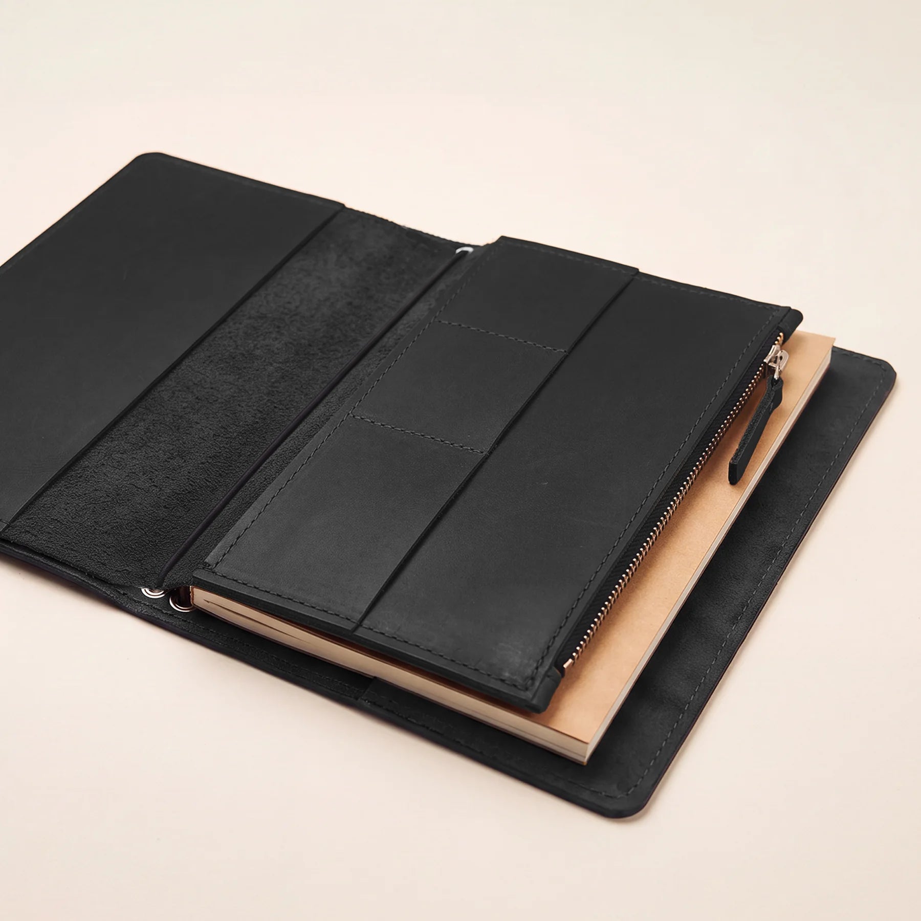 Handmade leather notebook insert for keeping cards and notes neatly organized.