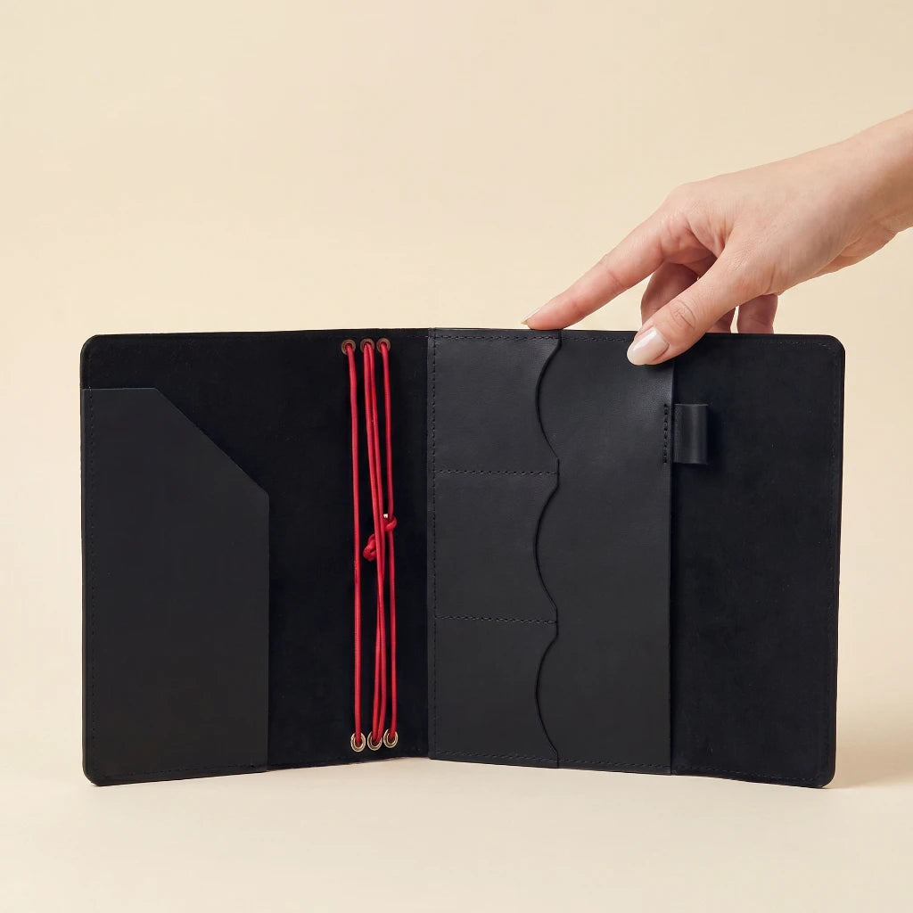 Leather notebook protector with elastic bands and pen loop for writing convenience