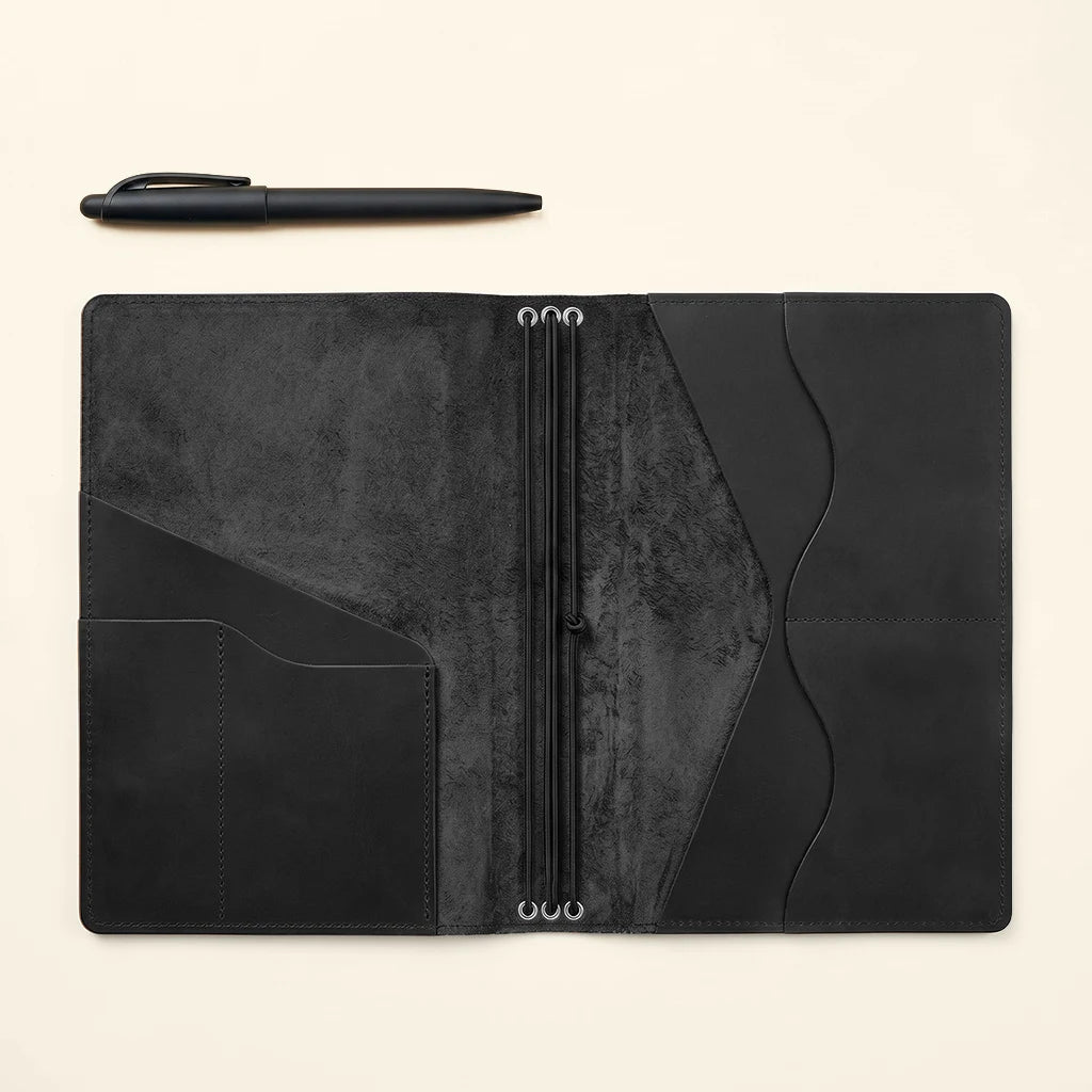 Refillable journal system with practical pockets and secure elastic bands.