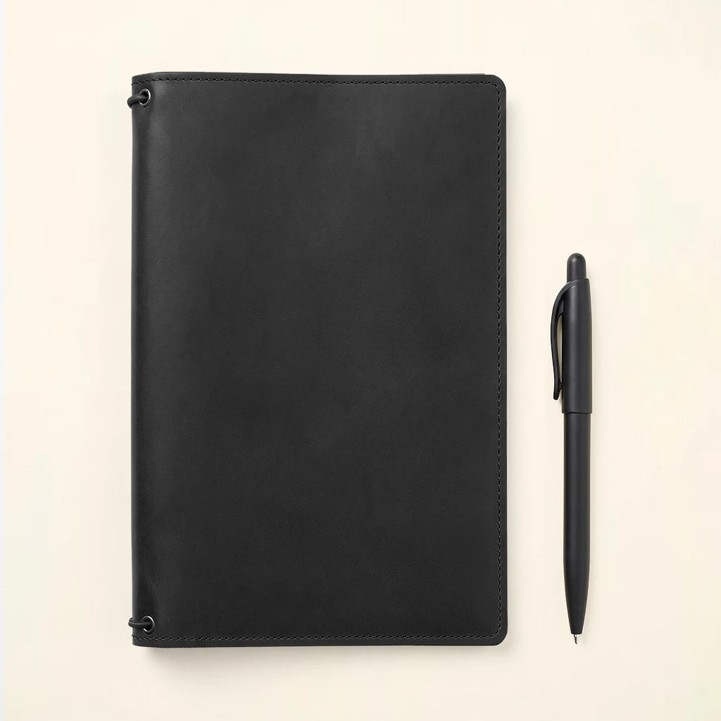 Refillable notebook holder made from premium leather with minimalist styling.