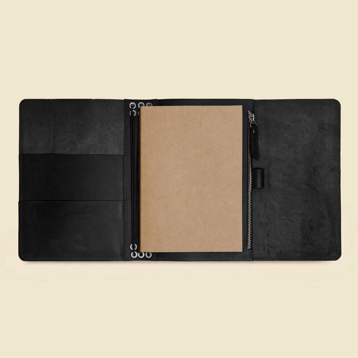 Open genuine leather writing case designed to keep notebooks and small items organized.