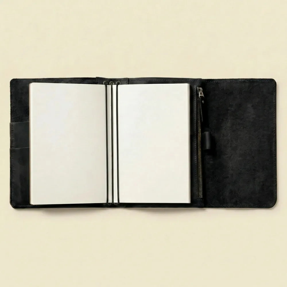 Elegant refillable journal cover crafted from genuine leather materials.