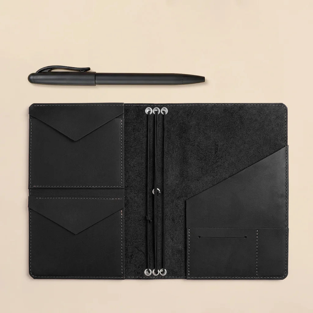 Leather notebook cover with handcrafted finish, organized pockets, and refillable elastic notebook system.
