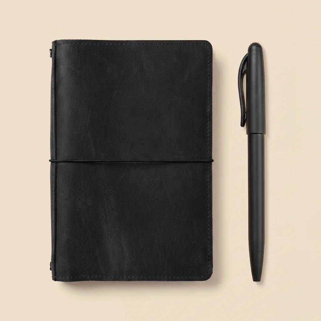 Genuine leather planner organizer with secure elastic notebook bands and functional interior pockets.