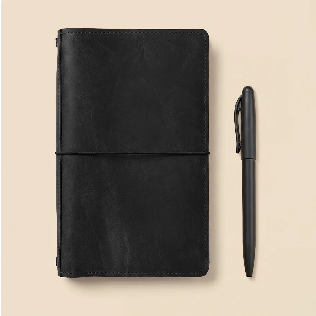 Refillable journal organizer made from premium leather with multiple storage compartments inside.