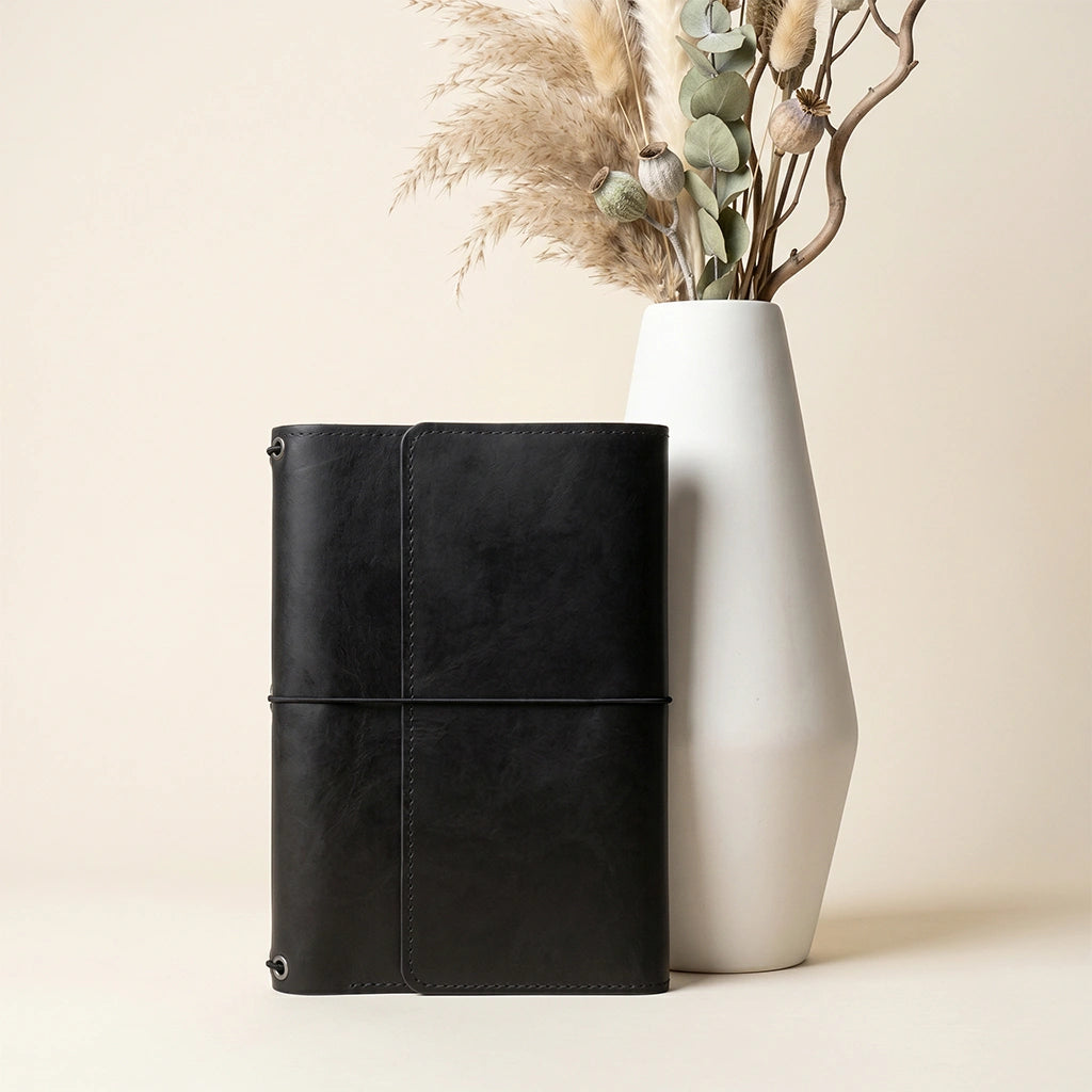 Genuine leather journal organizer with practical elastic notebook attachment and pen sleeve.