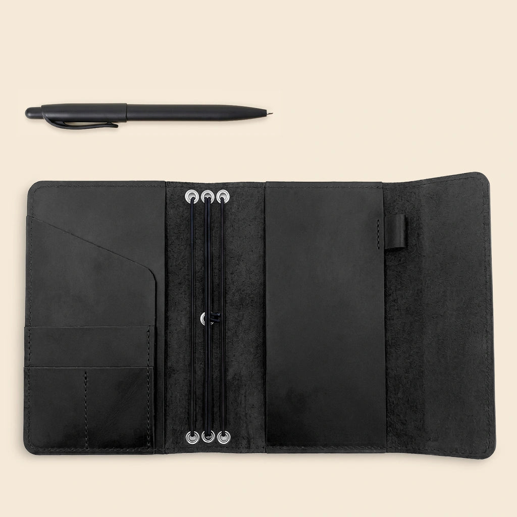 Full grain leather notebook organizer featuring practical pen loop and elastic notebook straps.