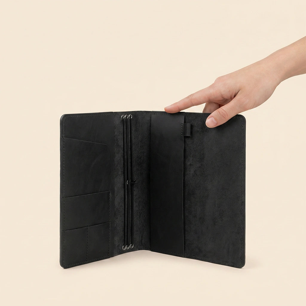 Genuine leather notebook case with practical storage options and refillable insert design.