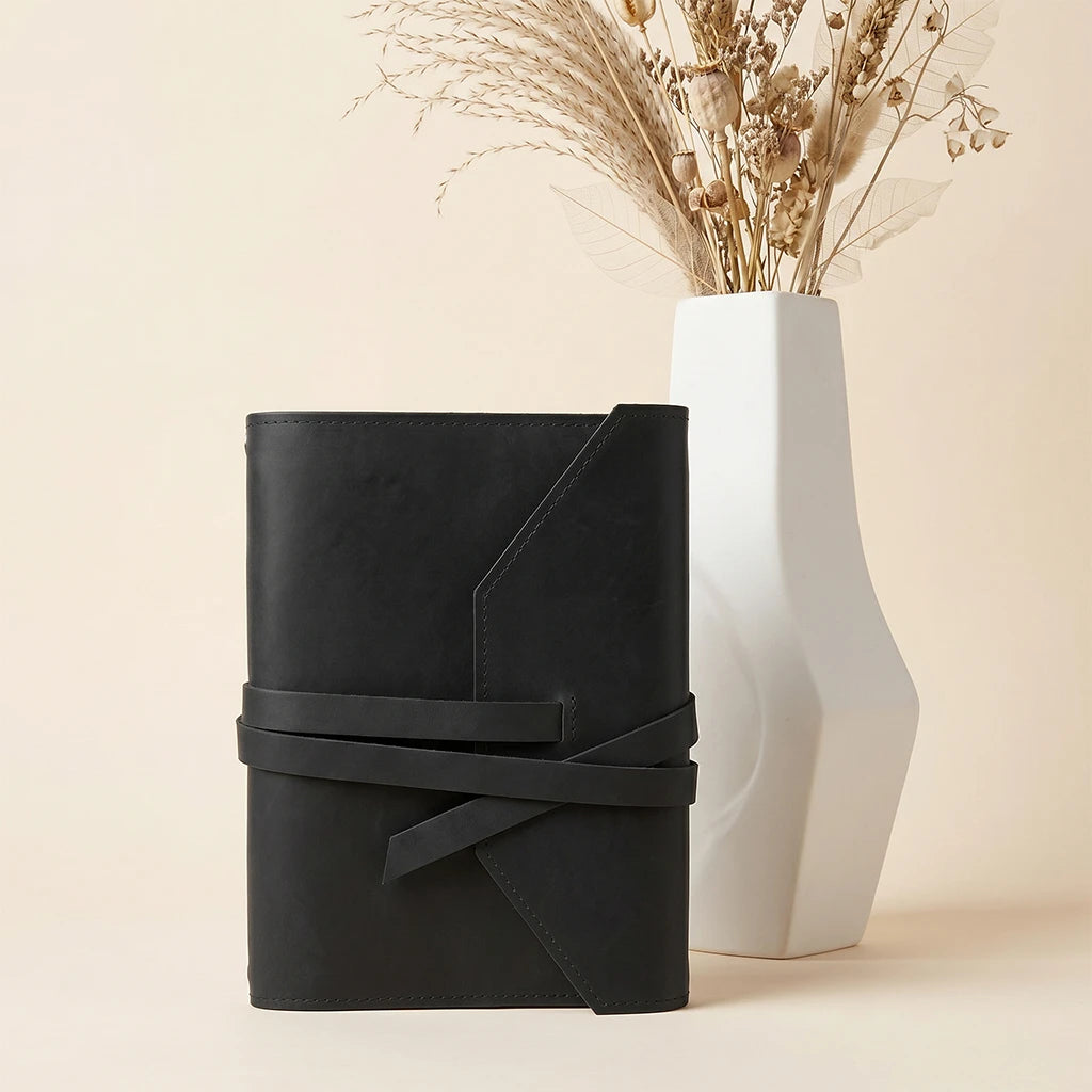 Professional leather notebook organizer featuring pen loop and elastic retention.