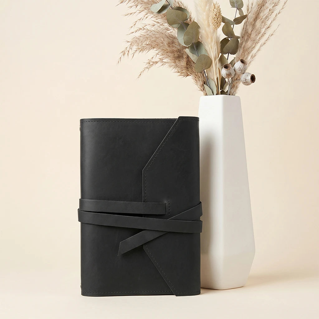 Leather notebook organizer featuring pen holder loop and stretch elastic bands.