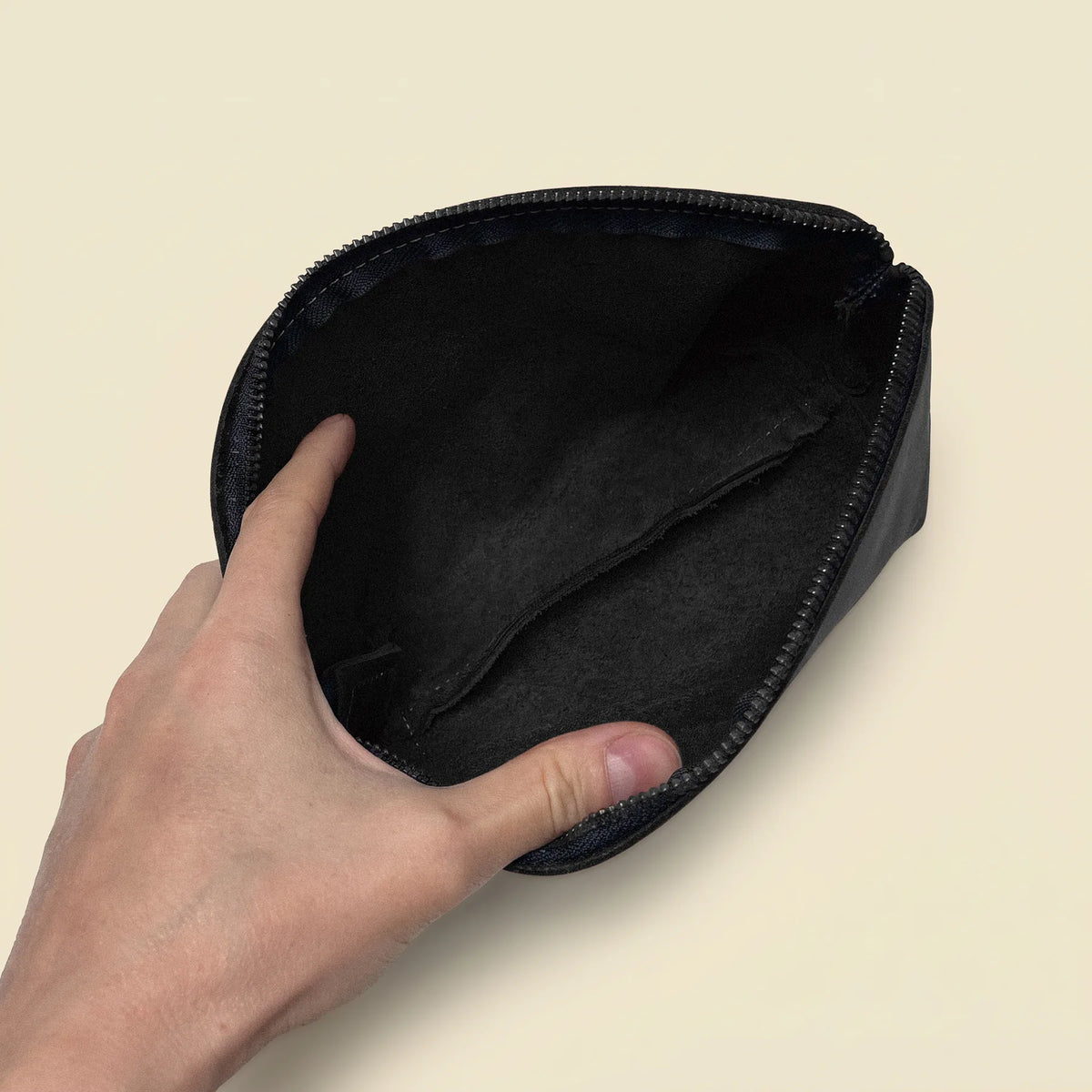Handmade genuine leather toiletry pouch with secure zipper and compact storage