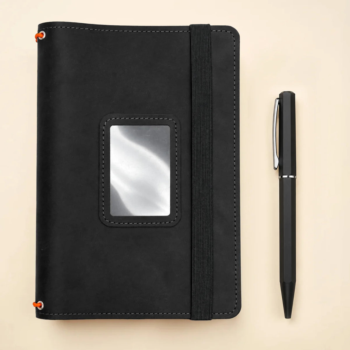 Handmade leather notebook case with three flexible elastic holders and spacious storage sections.