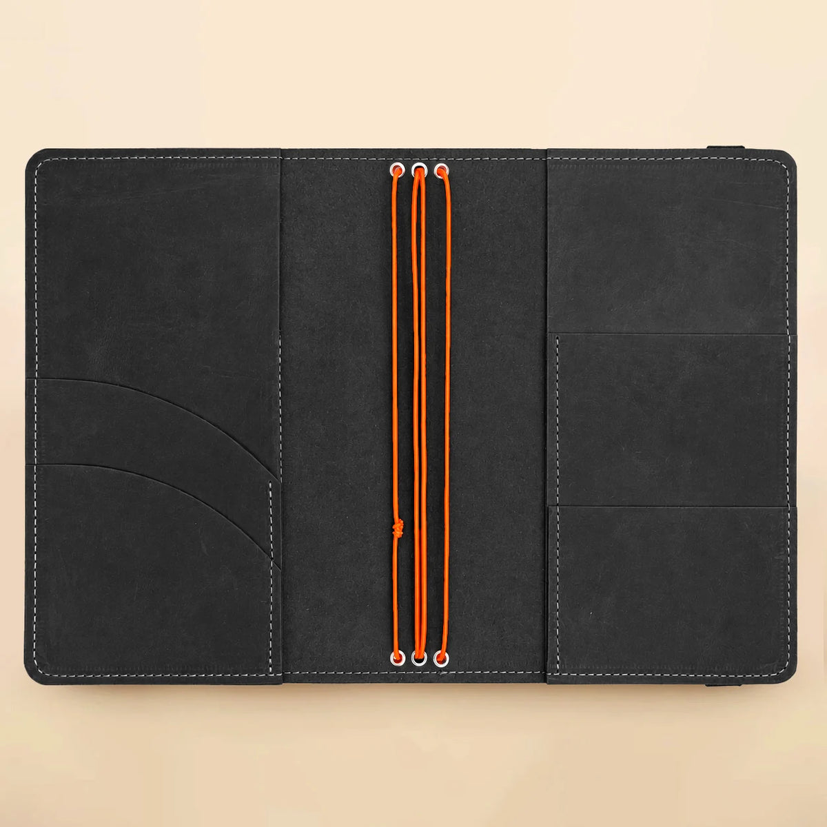 Handmade leather notebook featuring three elastic bands, concealed pockets, and transparent exterior window for pictures.