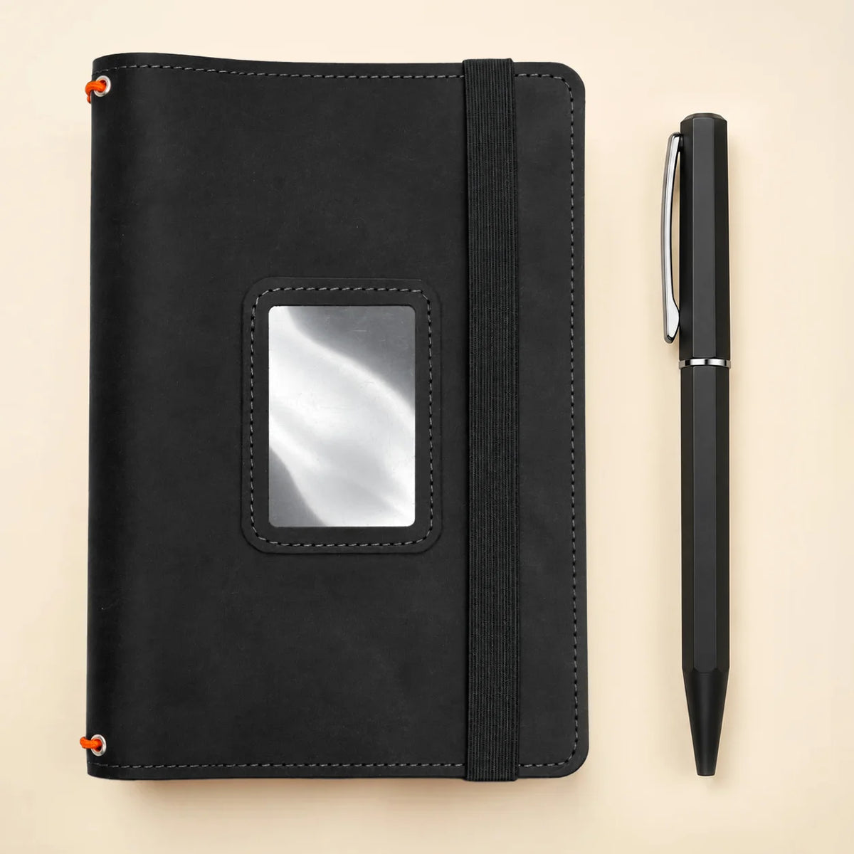 Handmade genuine leather journal cover with three elastic bands and functional storage pockets.