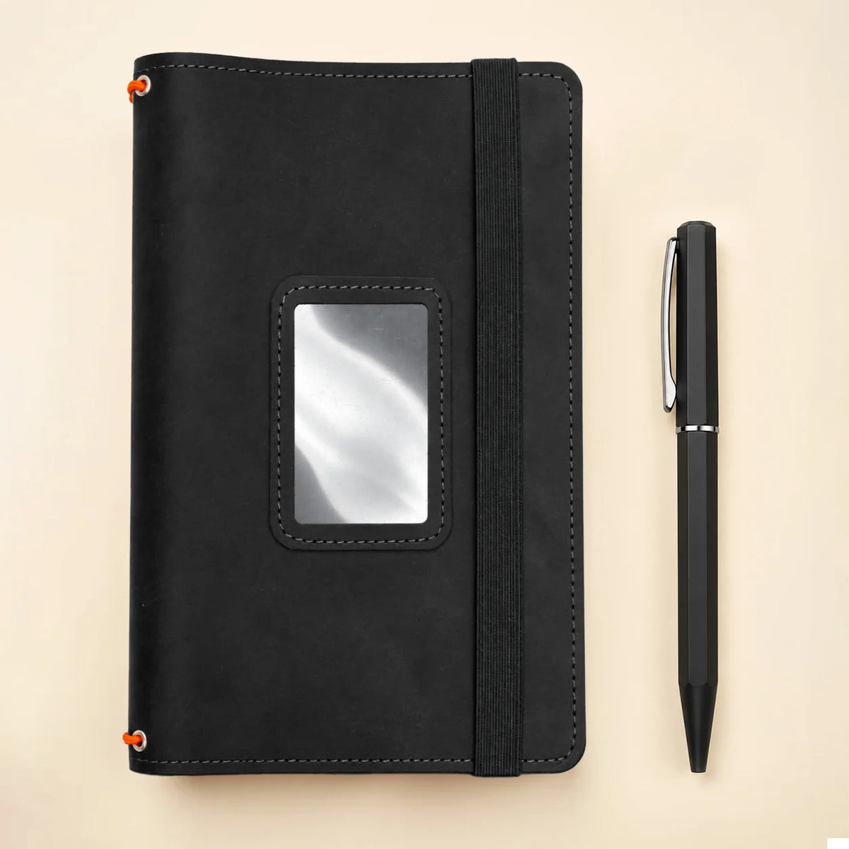 Handmade leather cover with three elastic notebook bands and useful inner storage spaces.