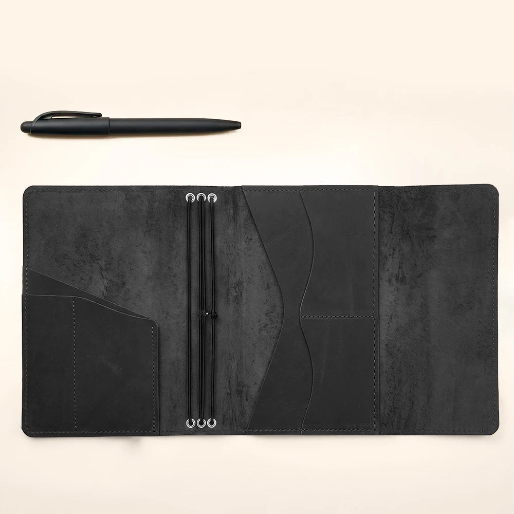 Leather journal organizer featuring premium craftsmanship, elastic notebook bands, and utility pockets.