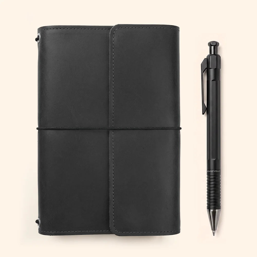 Natural hide journal case with interior pockets arranged around a dedicated pen holder.