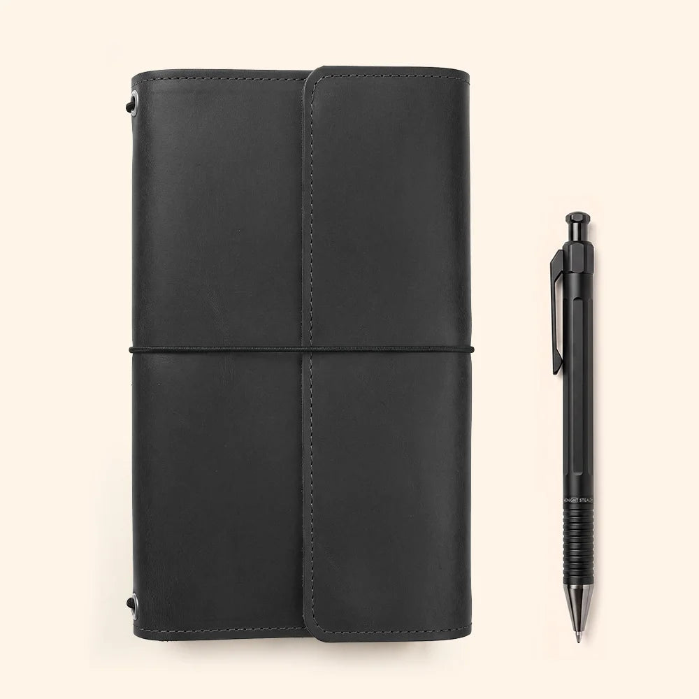 Genuine leather planner cover featuring interior pockets and an attached loop for carrying pens.