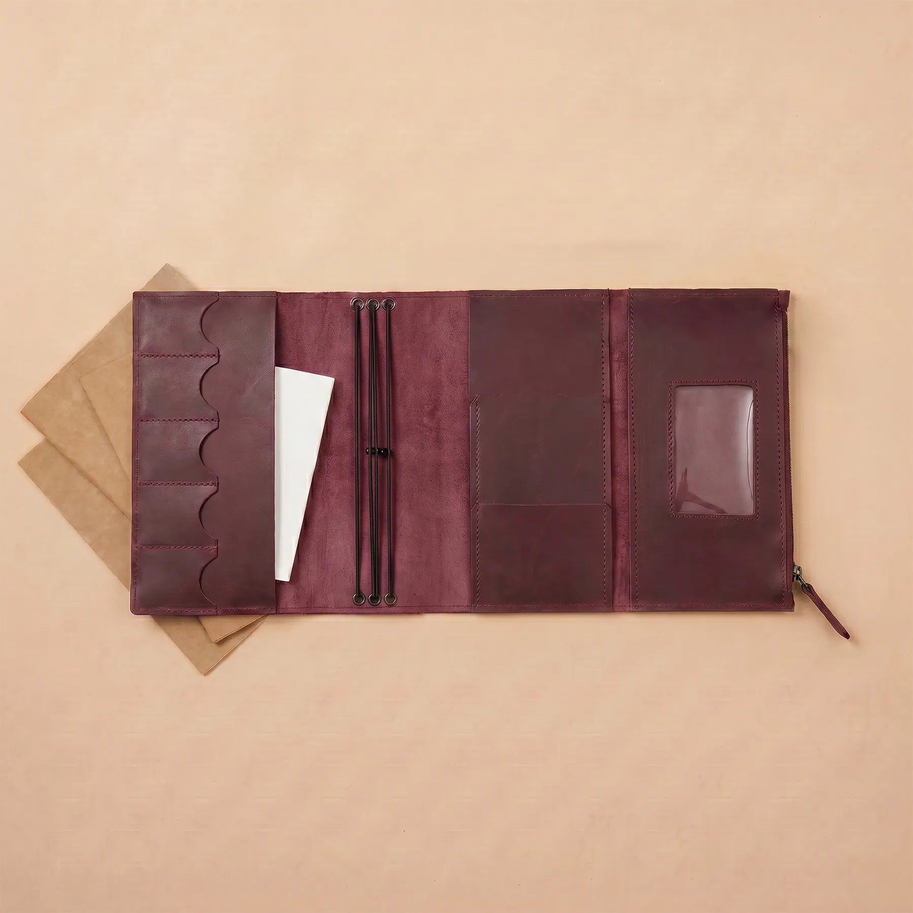 Handmade leather notebook cover featuring durable stitching and authentic leather finish.