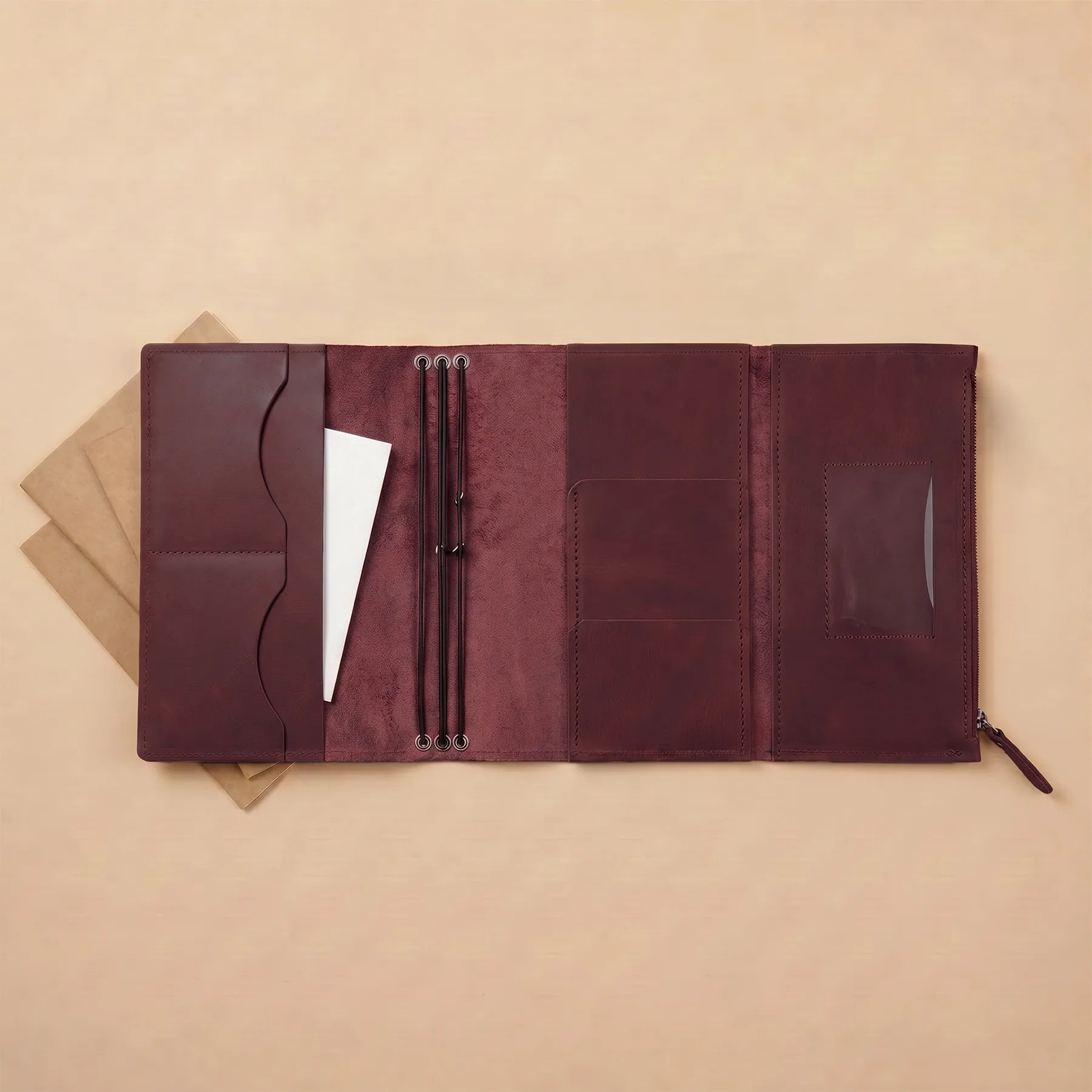 Premium leather notebook cover featuring refillable inserts and handcrafted leather construction.