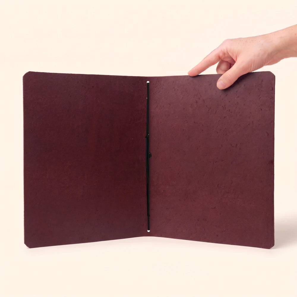 Compact leather journal sleeve created for simple organization and everyday note-taking.