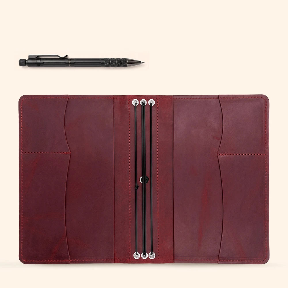 Leather notebook sleeve designed with organized compartments for papers and personal essentials.