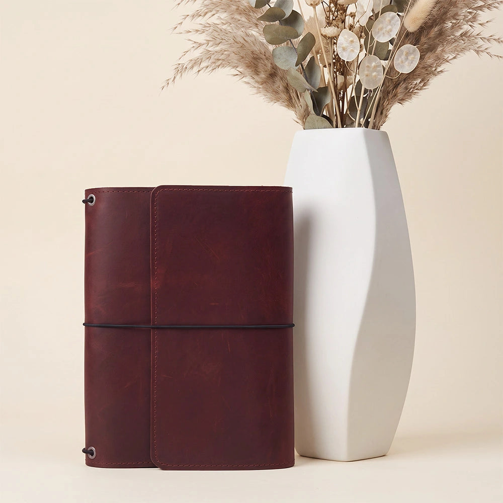 Leather writing organizer featuring card storage, document pockets, and practical pen keeper.