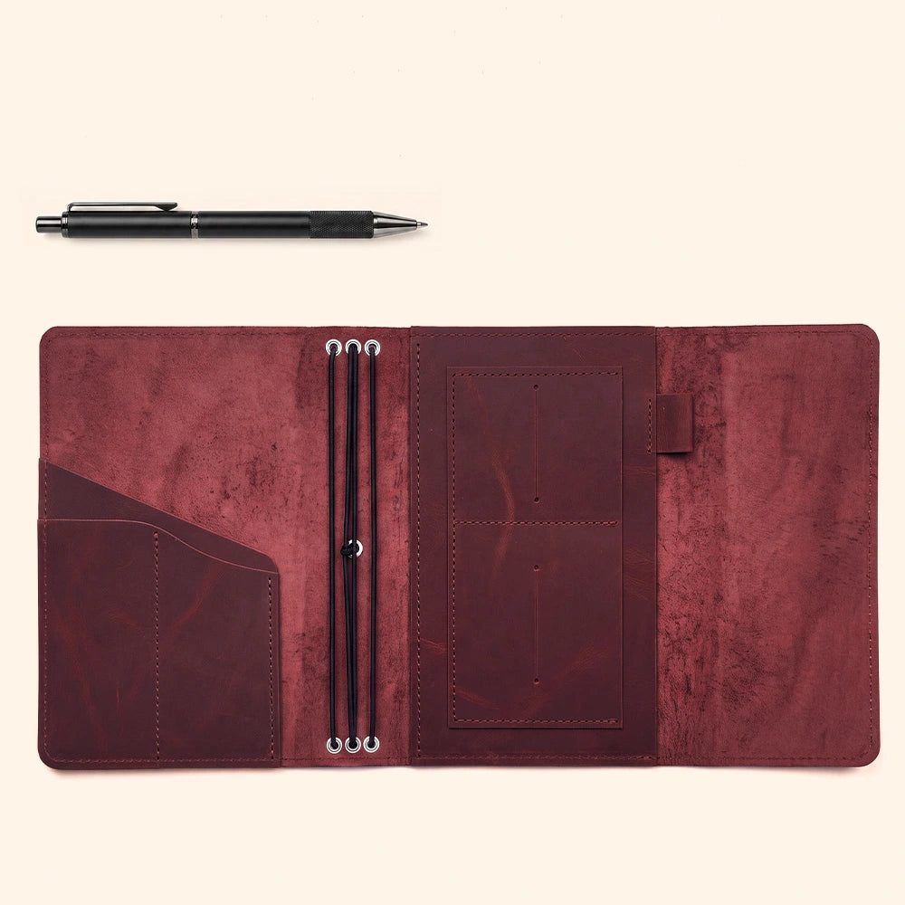 Leather notebook carrier featuring practical card compartments and stitched pen retention loop.
