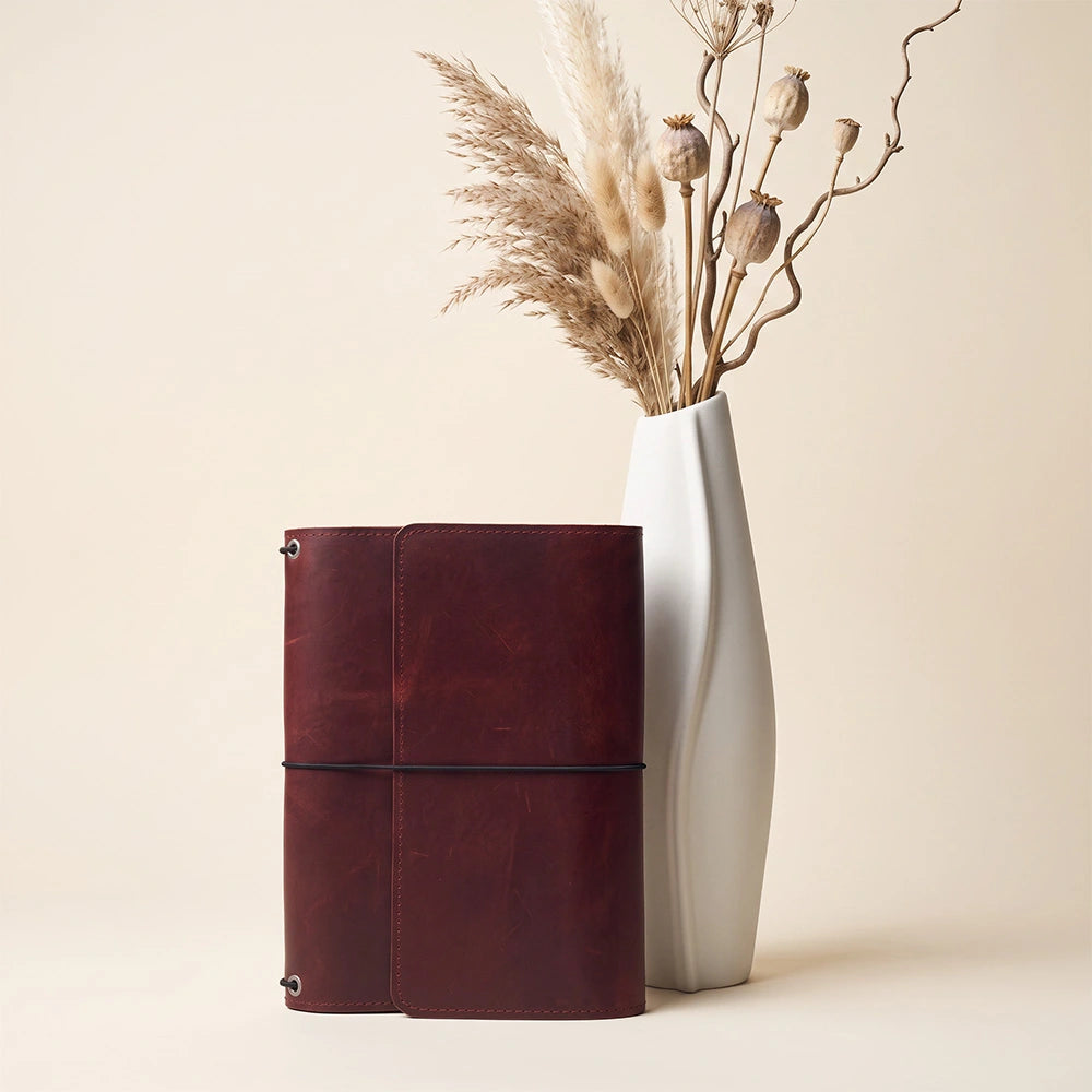 Genuine leather journal organizer with interior pockets and elegant leather pen loop inside.