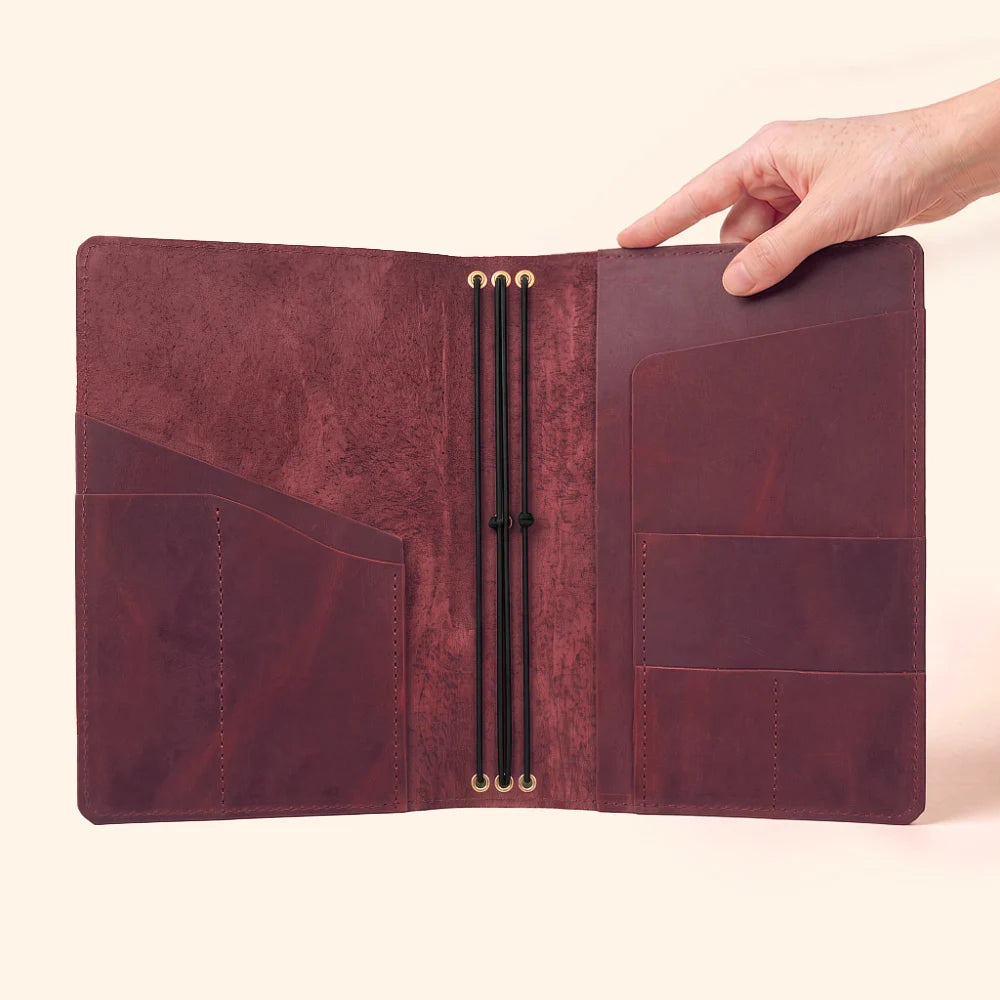 Compact leather notebook organizer for mixing three different journal inserts.