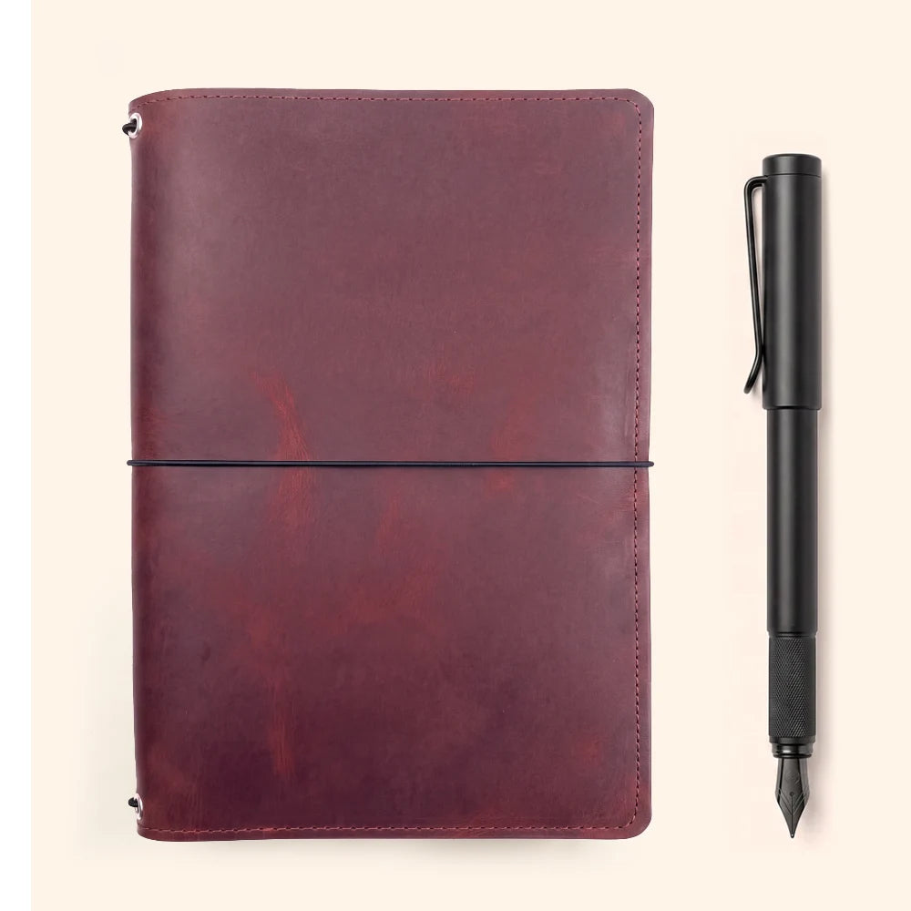 Elegant leather journal cover designed for three interchangeable refillable notebook inserts.