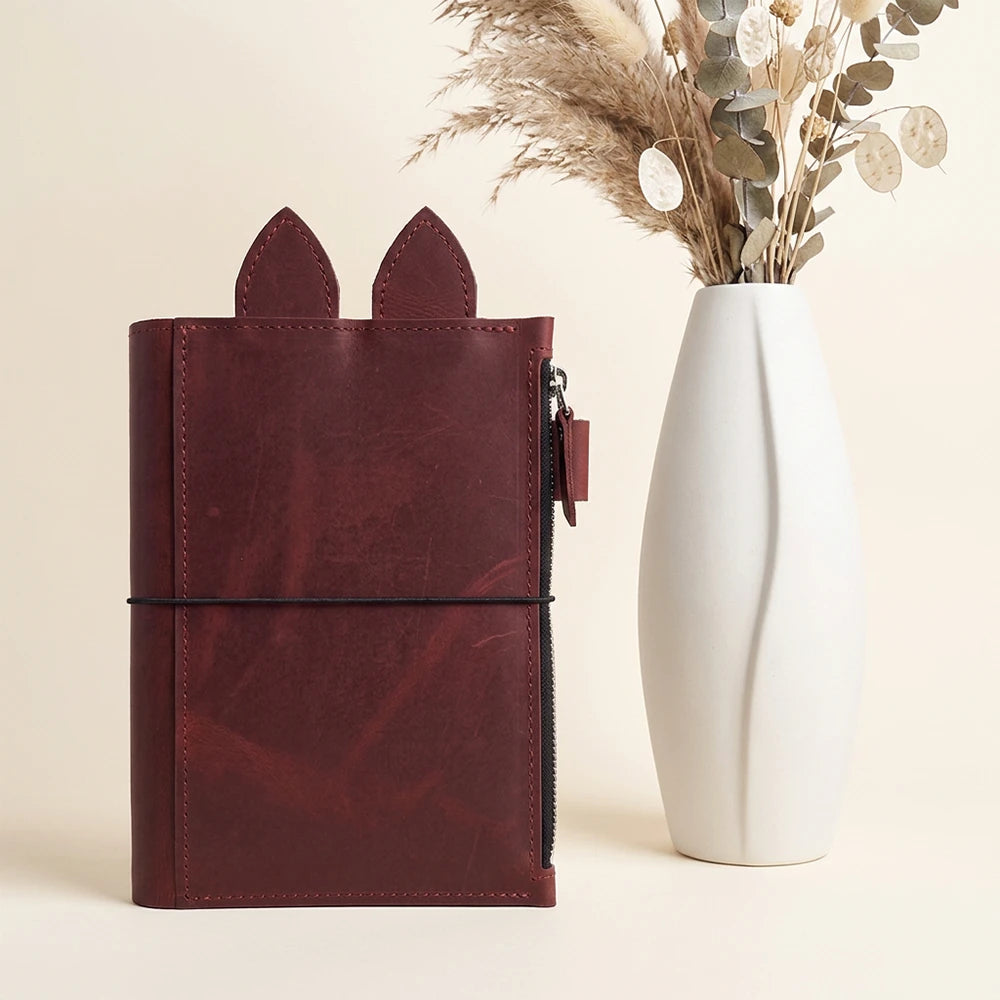Handmade planner cover showcasing three elastic holders across the center section.
