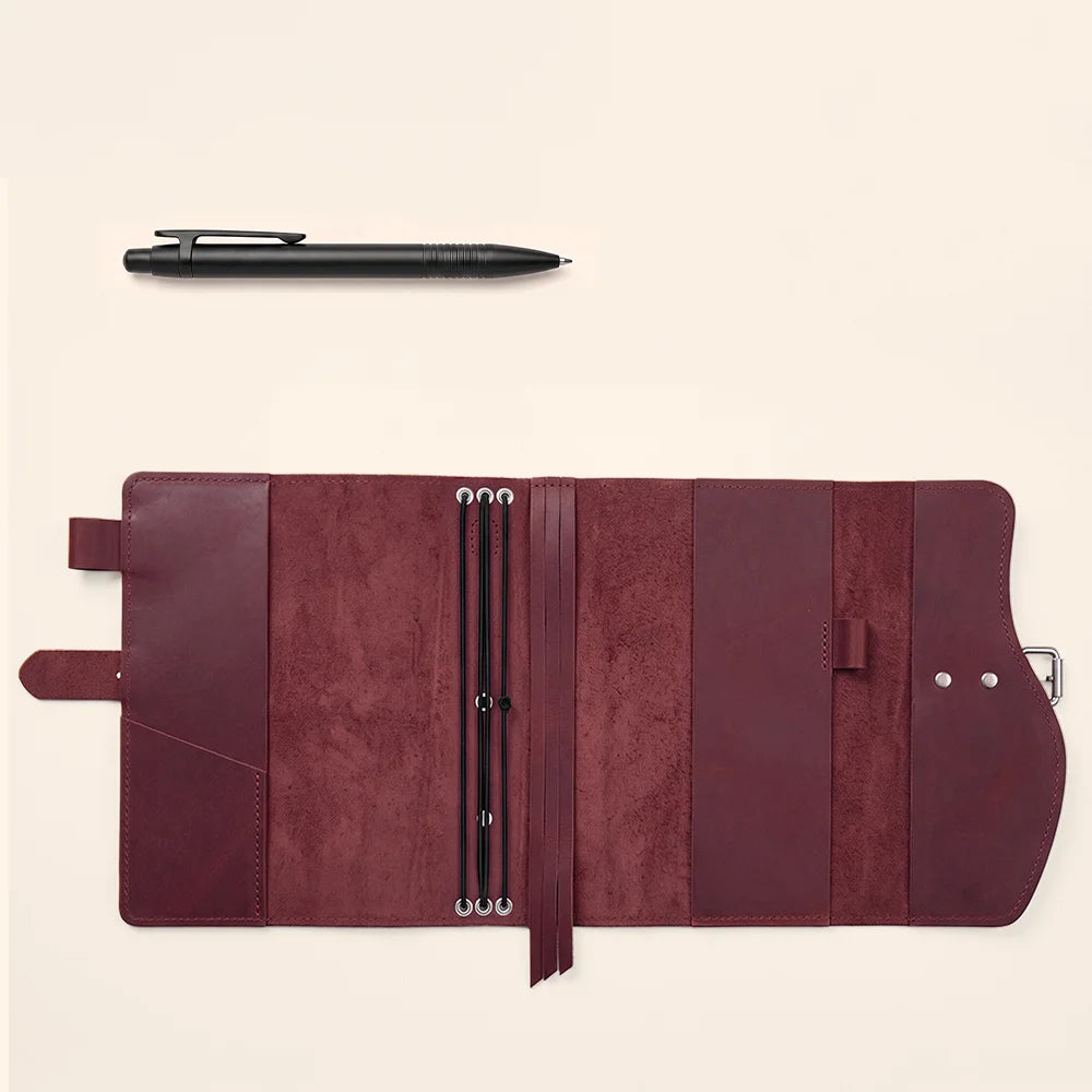 Genuine leather journal cover with multiple pockets, convenient pen loop, built-in bookmark, and carrying handle.